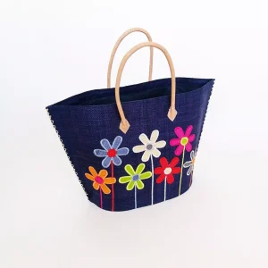 Cesta artesanal azul con flores