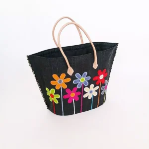 Cesta artesanal negra con flores